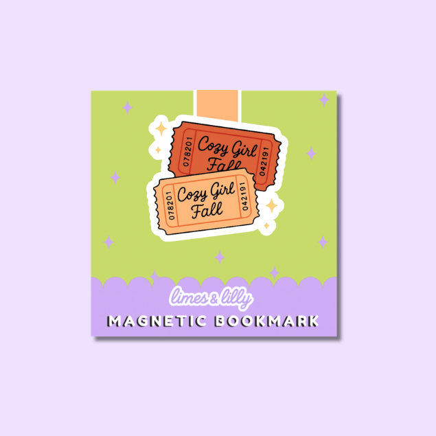 A square magnetic bookmark card on a light lavender background. The card features a lime green upper section with two illustrated orange and beige ticket graphics reading 'Cozy Girl Fall,' a lavender lower section, and the text 'limes & lily MAGNETIC BOOKMARK.