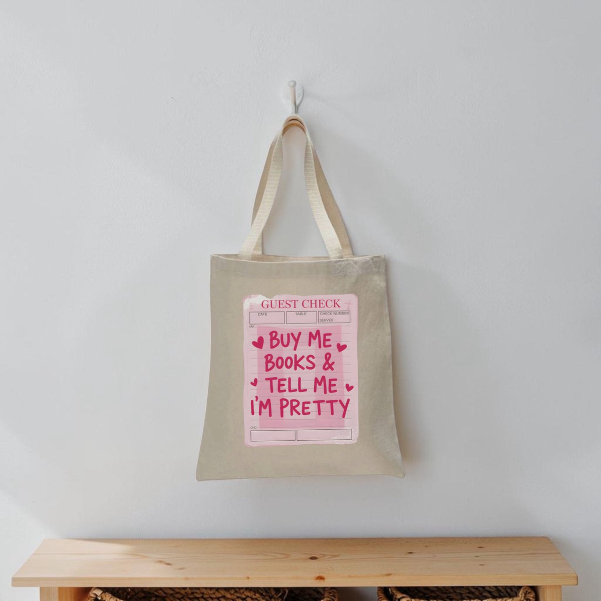 Limes & Lilly natural canvas tote bag featuring a pink Guest Check graphic print with book-themed typography.