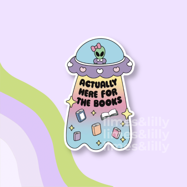 A die-cut sticker featuring a cute cartoon alien in a spaceship with the text 'ACTUALLY HERE FOR THE BOOKS' on a pastel gradient background, shown on a light purple graphic backdrop.