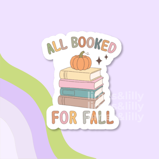 A die-cut sticker featuring a Halloween-themed book club design with the text 'HAUNTED BOOK CLUB' in orange, a striped purple and white background, a pumpkin, books, a witch hat, and small doodles, shown on a pastel lavender background with abstract green and purple shapes.