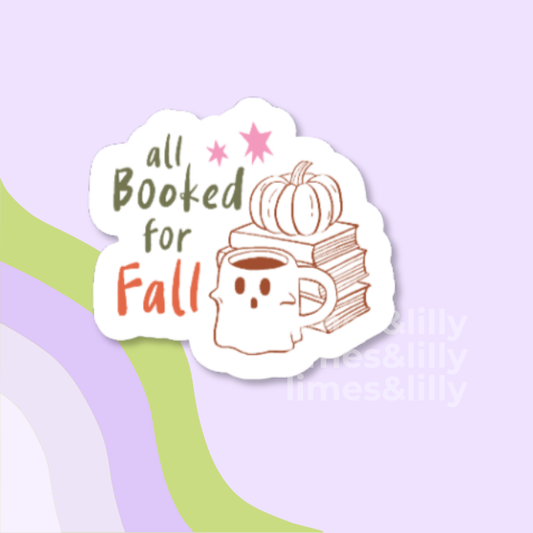 A die-cut sticker with the phrase 'all Booked for Fall' in dark green and orange lettering, featuring a cute ghost face mug reading 'Fall' with a pumpkin and books on top, shown on a pastel lavender background with abstract green and lavender curved shapes.