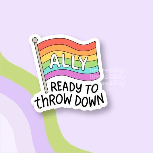 Sticker with rainbow flag and text 'ALLY READY TO THROW DOWN' on a light purple background