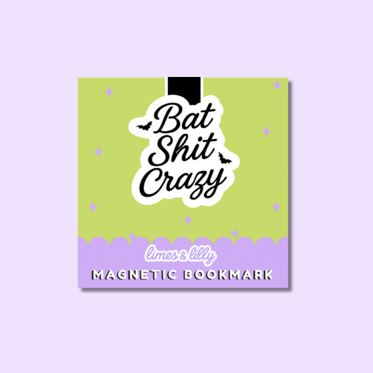 A square magnetic bookmark with a lime green top half and lavender bottom half, featuring the phrase 'Bat Shit Crazy' in black script on a white die-cut background, plus 'limes lilly' and 'MAGNETIC BOOKMARK' on the purple section. The product is centered on a light lavender background.