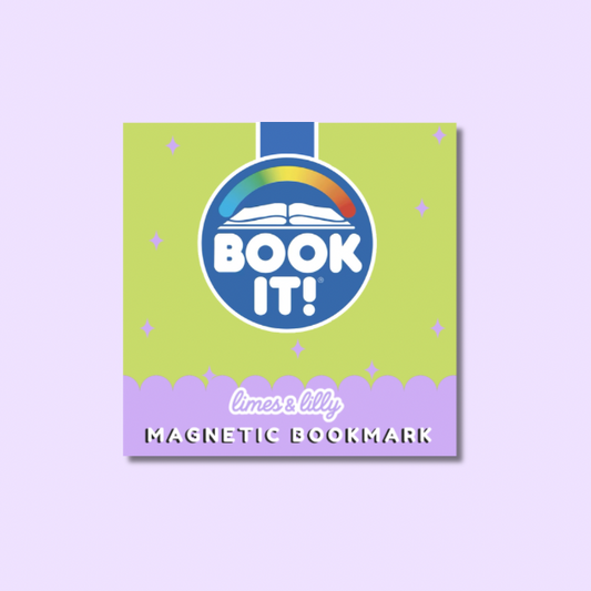 A square magnetic bookmark card with a lime green top section, a purple scalloped bottom band, and a blue circular logo featuring an open book and rainbow above the words 'BOOK IT!'. The text 'limes & lilys' and 'MAGNETIC BOOKMARK' appears on the lower band.