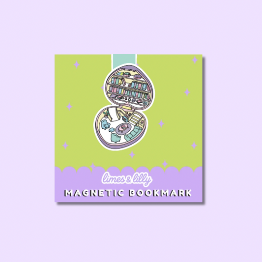 A square product card for a magnetic bookmark featuring a whimsical illustration of an open book with bookshelves and books inside, on a lime green background with a lavender bottom band. The text reads 'limes lily' and 'MAGNETIC BOOKMARK'.