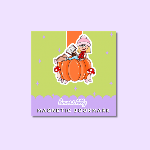 A square magnetic bookmark featuring a cartoon illustration of a girl reading on a pumpkin, with the text 'limes & lilly' and 'MAGNETIC BOOKMARK' on a light purple background.