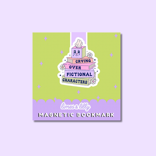 A square sticker-style magnetic bookmark with a pastel illustration of stacked books and a tissue box, plus the text 'CRYING OVER FICTIONAL CHARACTERS' and 'limes & lilly MAGNETIC BOOKMARK' on a light lavender background.
