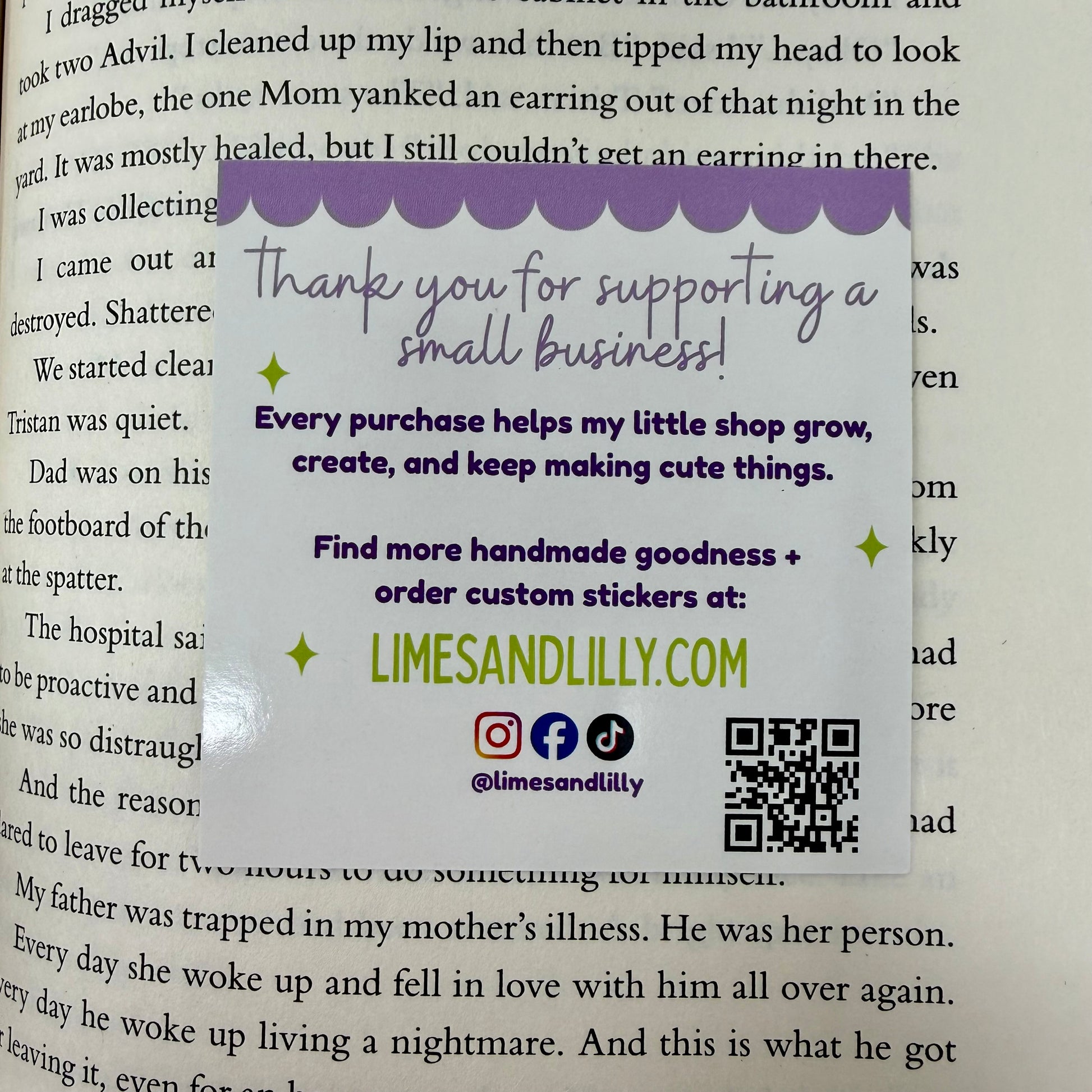 Handwritten note on a book page with promotional text and branding details.