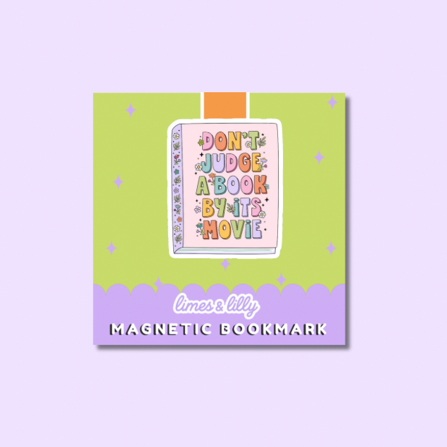 A square product card for a magnetic bookmark featuring a colorful book illustration with the phrase “DON'T JUDGE A BOOK BY IT'S MOVIE” on a lime green background with a lavender bottom banner reading “limes & lily MAGNETIC BOOKMARK.”.