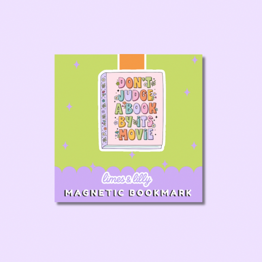 A square product card for a magnetic bookmark featuring a colorful book illustration with the phrase “DON'T JUDGE A BOOK BY IT'S MOVIE” on a lime green background with a lavender bottom banner reading “limes & lily MAGNETIC BOOKMARK.”.