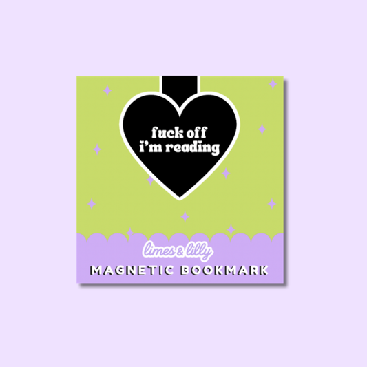 A square magnetic bookmark card with a pastel design, featuring three cartoon ghosts in pink and purple tones under a black cloud with the word 'BOO' and the phrase 'you whare' in white script. The bottom section is lavender with the text 'limes & lily MAGNETIC BOOKMARK'.
