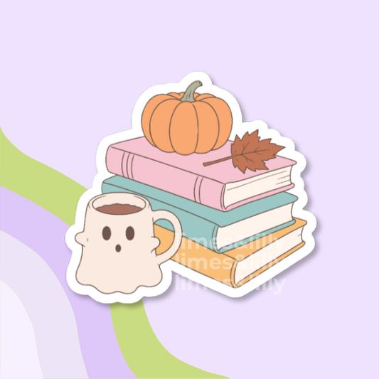 A die-cut sticker featuring a stack of three books topped with an orange pumpkin and a brown leaf, alongside a ghost-shaped mug filled with coffee, shown on a pastel purple background with abstract green and lavender curved shapes.