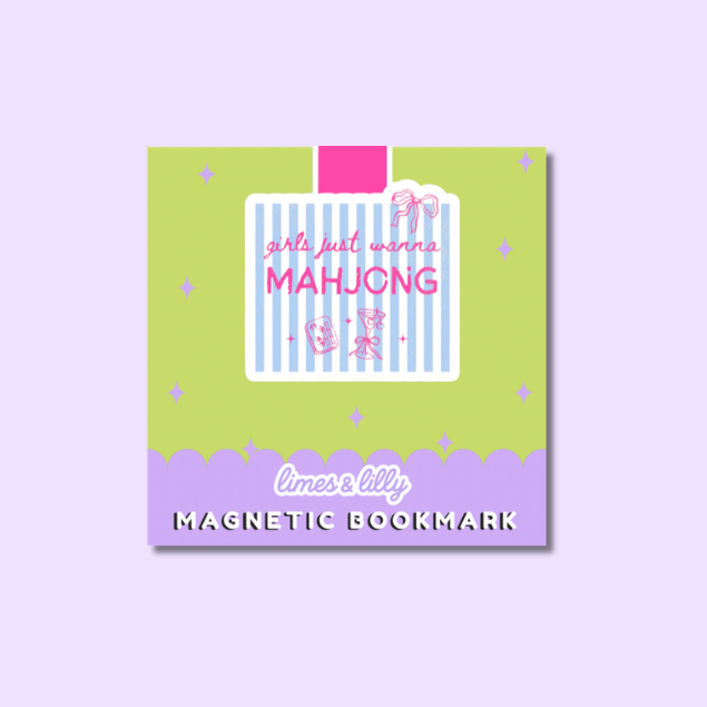 A square decorative magnetic bookmark card shown on a light lavender background. The card has a lime green top section with a central white label outlined in pink, pink text reading 'girls just want MAHJUNG', and a lavender bottom band with the words 'limes lilly' and 'MAGNETIC BOOKMARK'.