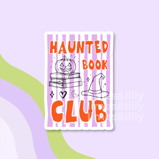 A die-cut sticker featuring a Halloween-themed book club design with the text 'HAUNTED BOOK CLUB' in orange, a striped purple and white background, a pumpkin, books, a witch hat, and small doodles, shown on a pastel purple background with abstract green and lavender shapes.