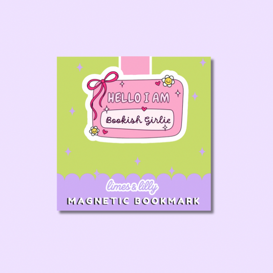 A square magnetic bookmark card with a pastel design, featuring a lime green top section, a lavender bottom band, and a central pink label that reads 'HELLO I AM Bookish Girlie.' The card is shown on a light lavender background.