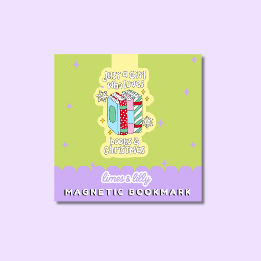 A die-cut sticker featuring a festive illustration with the text 'Coffee, Books & Christmas things.' The design shows a pink book with a green cover and Santa hat, next to a pink iced coffee cup with a candy cane straw, on a pastel lavender background.