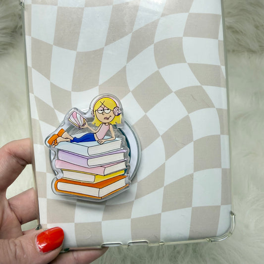 Phone case with a design of a person sitting on books against a checkered background