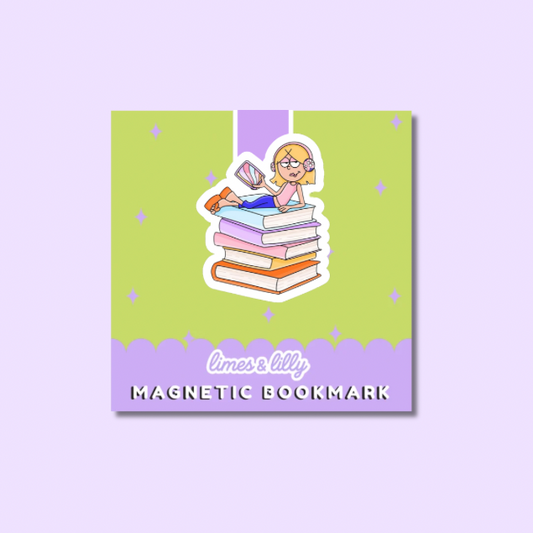 Magnetic bookmark with cartoon character on a stack of books against a purple background