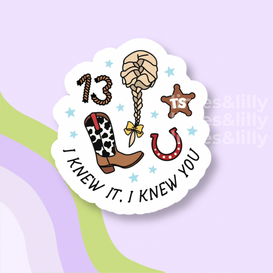 Sticker with cowboy boot, lasso, and horseshoe design on a light purple background