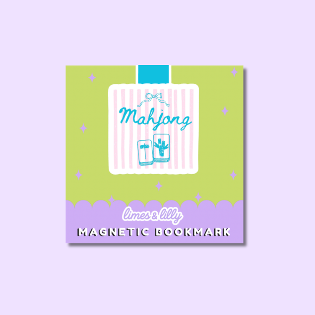 A square decorative magnetic bookmark card shown on a light lavender background. The card has a lime green top section with small star accents, a white central panel with pink vertical stripes, a blue ribbon graphic, the word 'Mahjong' in blue script, and a lavender bottom band with the text 'limes & lilly' and 'MAGNETIC BOOKMARK' in white and black.