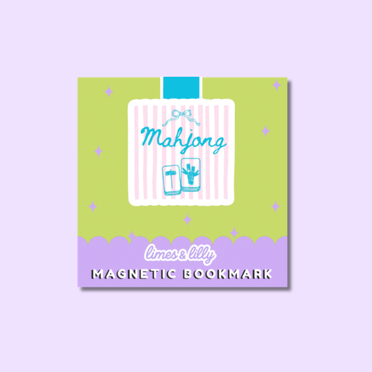 A square decorative magnetic bookmark card shown on a light lavender background. The card has a lime green top section with small star accents, a white central panel with pink vertical stripes, a blue ribbon graphic, the word 'Mahjong' in blue script, and a lavender bottom band with the text 'limes & lilly' and 'MAGNETIC BOOKMARK' in white and black.