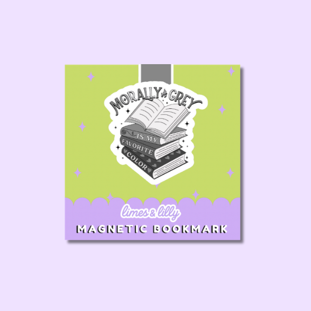 A square magnetic bookmark card with a lime green top half and lavender bottom border, featuring a central illustration of stacked books with the text 'Morally Grey is my favorite color.' The product is centered on a light lavender background.