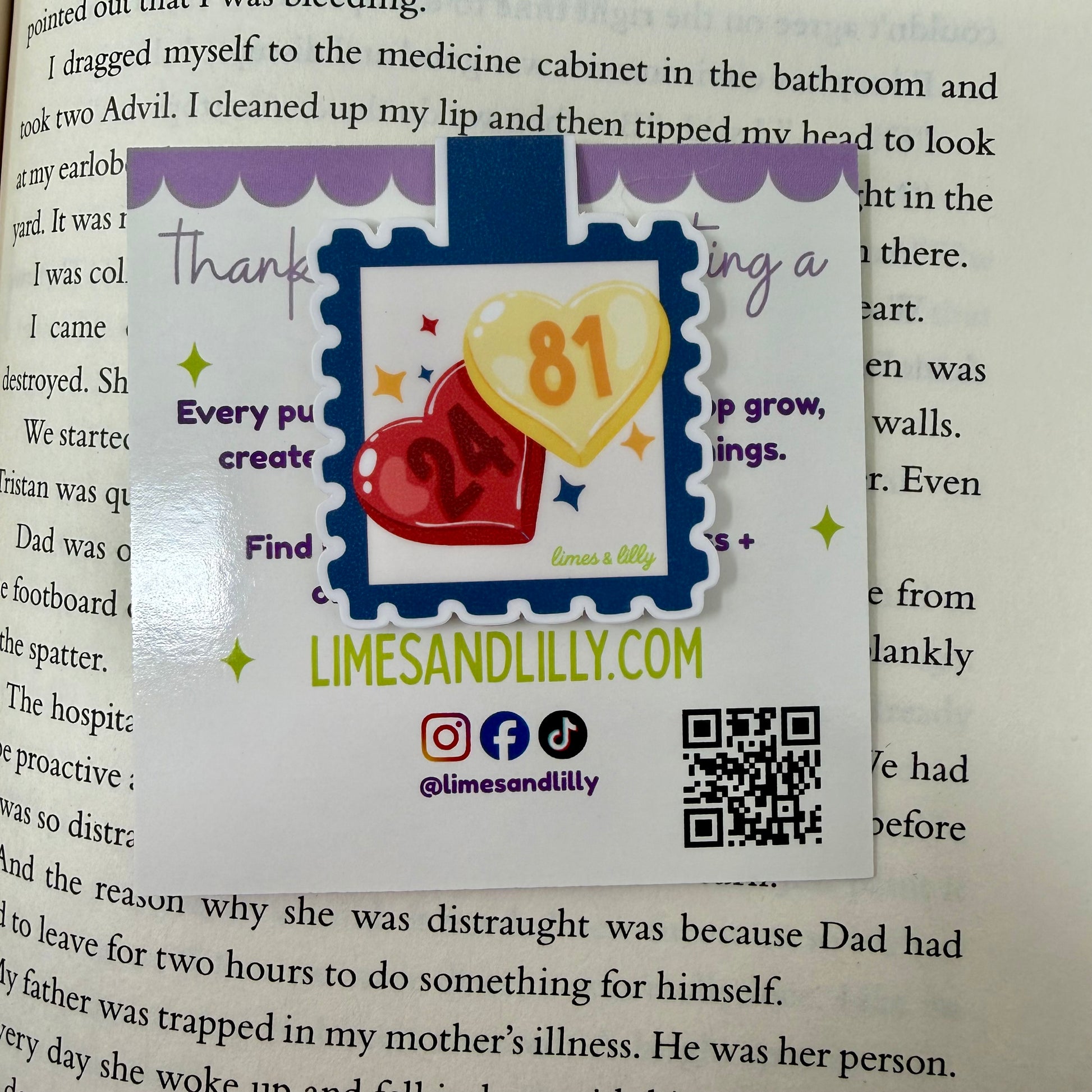 Colorful bookmark with hearts and text on a book page