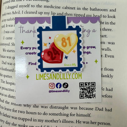 Colorful bookmark with hearts and text on a book page