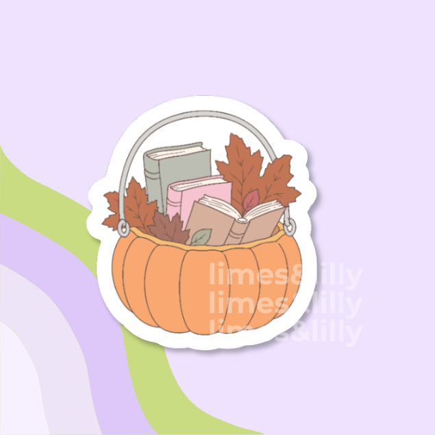 A die-cut sticker featuring an autumn illustration of a pumpkin basket filled with books and fall leaves, shown on a pastel purple background with abstract green and lavender curved shapes. The sticker has a white border and a faint repeating 'limes&lilly' watermark.