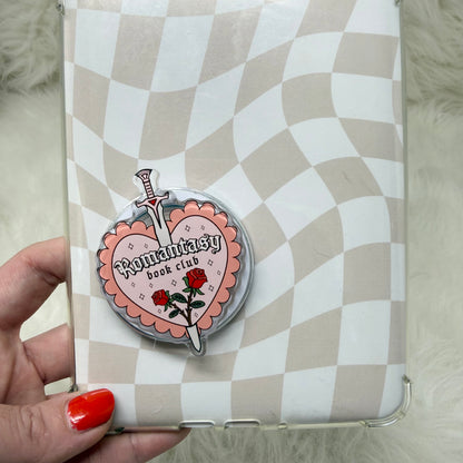 Phone case with a heart-shaped 'Romantic Book Club' design on a checkered background
