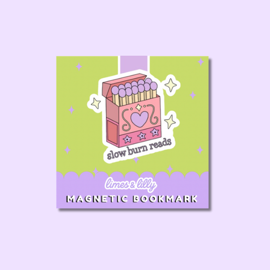 A square magnetic bookmark with a pastel design, featuring a pink matchbox illustration with the phrase 'slow burn reads' on a light green background with a lavender bottom banner. The brand name 'limes & lily' is visible at the bottom.