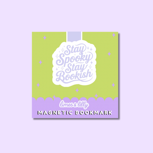A square magnetic book cover or bookmark design shown on a light lavender background. The product has a lime green upper section with small lavender stars, a white central label reading 'Stay Spooky Stay Bookish' in lavender script, and a lavender bottom band with the text 'limes & lily' and 'MAGNETIC BOOKMARK'.