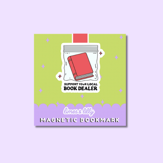 A square product mockup for a magnetic bookmark. The bookmark features a lime green top section with a white sticker-like illustration of a red book inside a clear bag, plus the text 'SUPPORT YOUR LOCAL BOOK DEALER'.