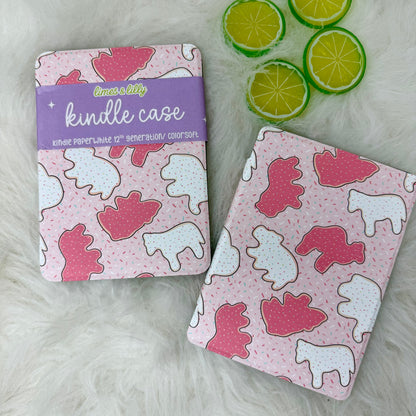 Pink and white Kindle case with animal pattern and purple label on a white surface with lime slices.