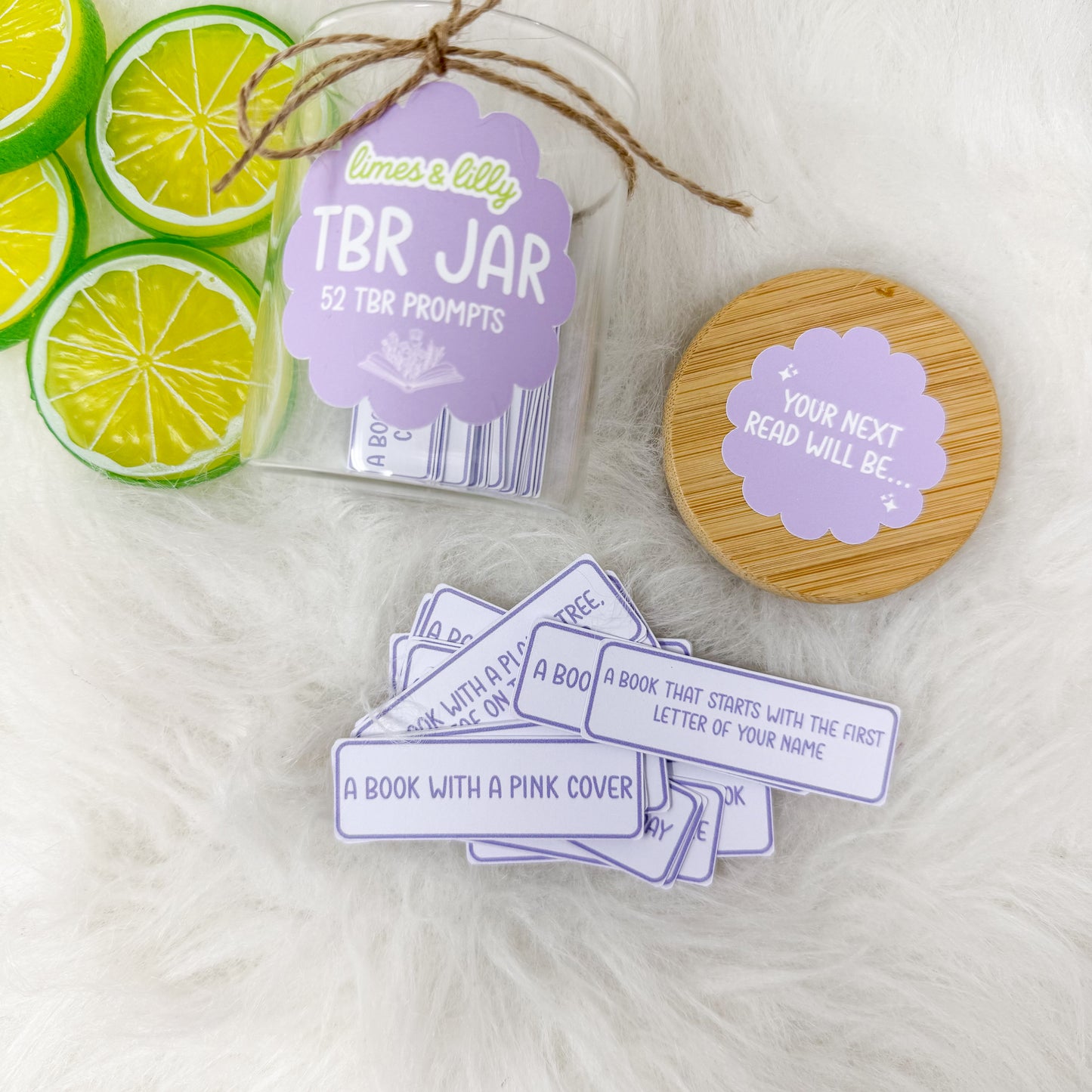 TBR Jar with lime slices and TBR prompts on a white background