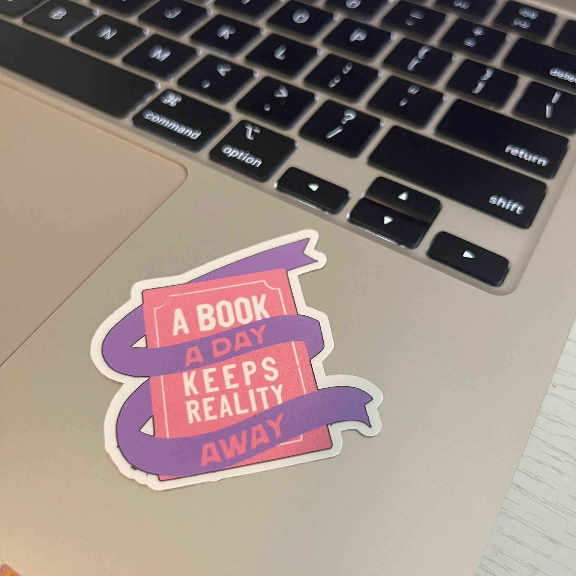 A book a day keeps reality away sticker, book stickers, kindle, laptop, bookstagram, spicy romance bookish sticker, pink book