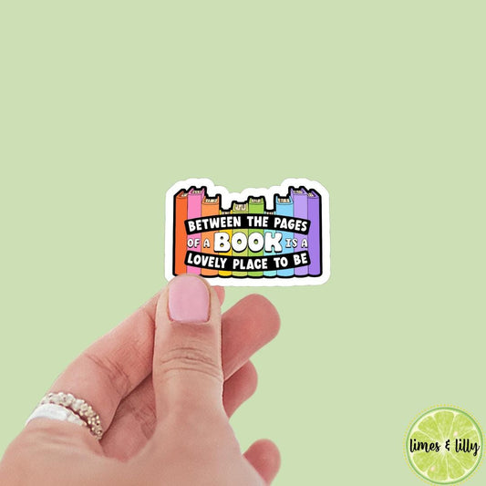 Between the Pages of a Book is a Lovely Placd to Be Book Stack Sticker | bookish stickers, book lover, book stickers, kindle, laptop
