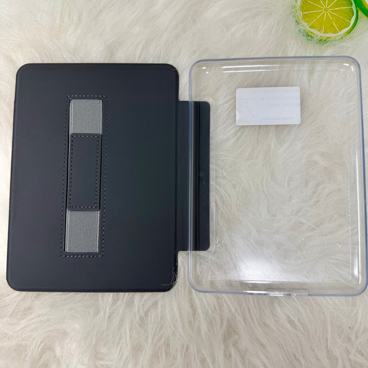 Open Showgirl Kindle case showing the built-in hand strap and protective interior cover