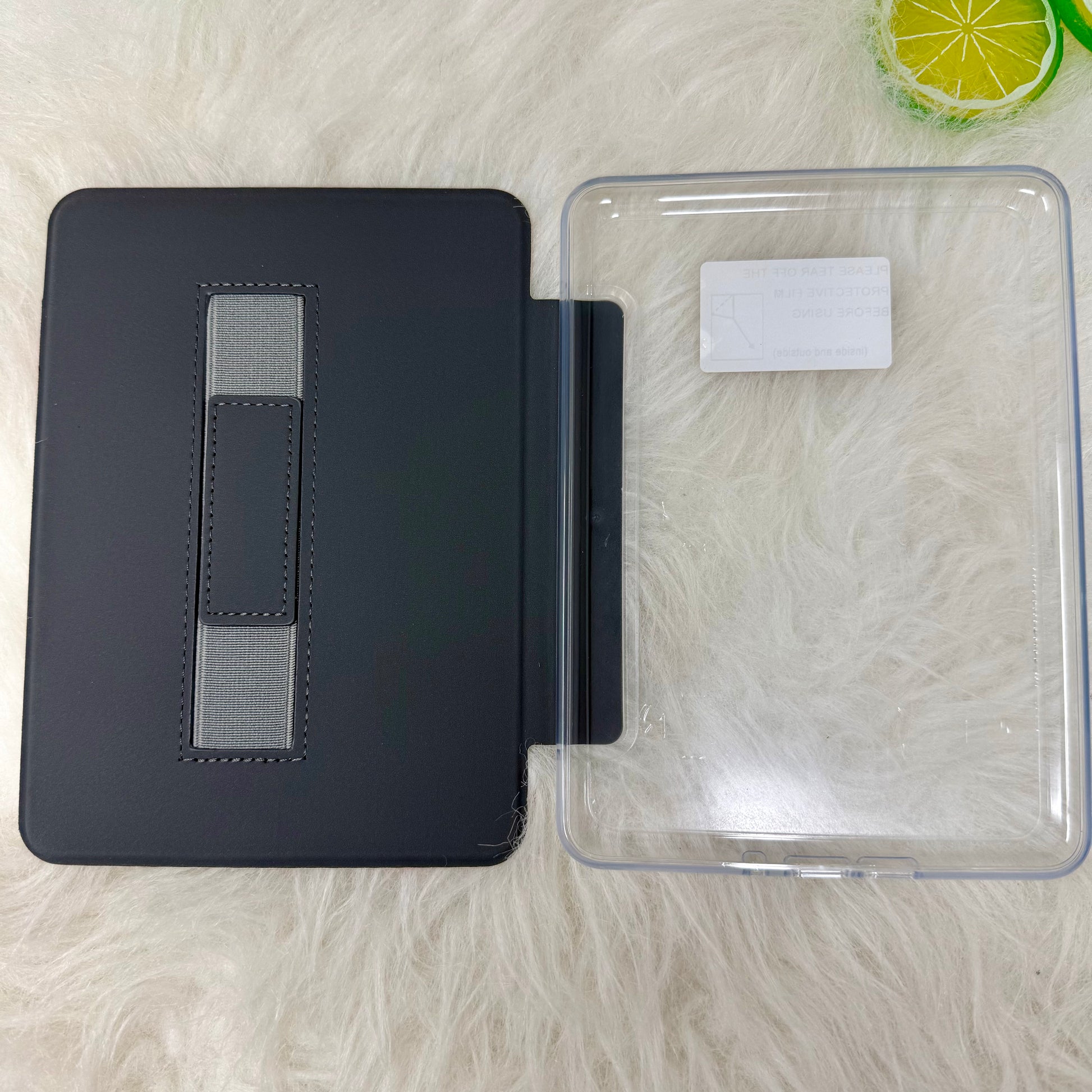 Open Showgirl Kindle case showing the built-in hand strap and protective interior cover
