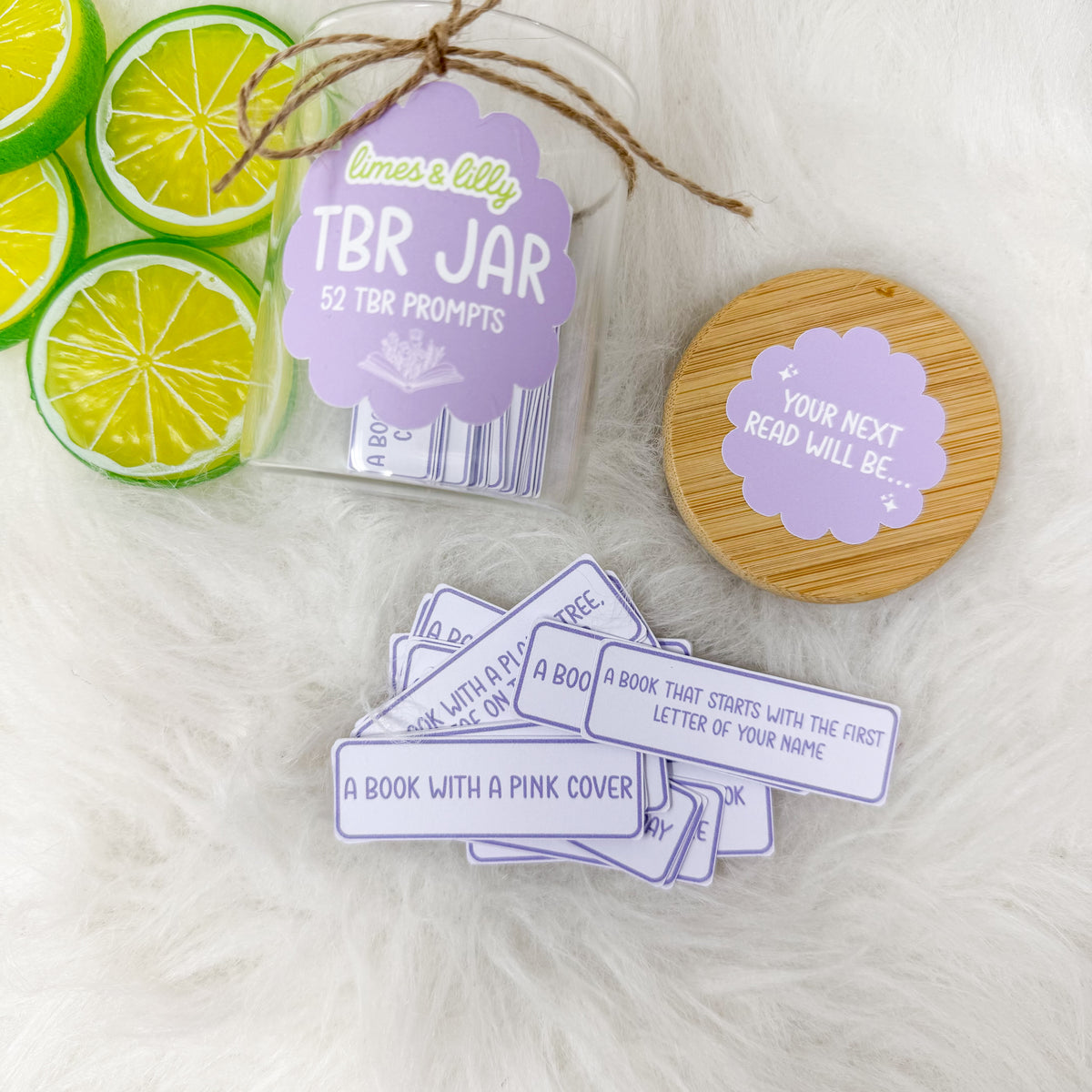 TBR jar displayed with individual reading-prompt cards and decorative lime slices