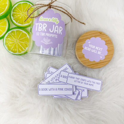TBR jar displayed with individual reading-prompt cards and decorative lime slices